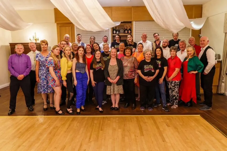 Company members together for a group photograph